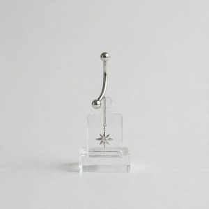 Illustrative styling image of a dangling belly button ring