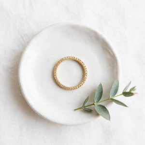 Illustrative styling image of an oval wedding band